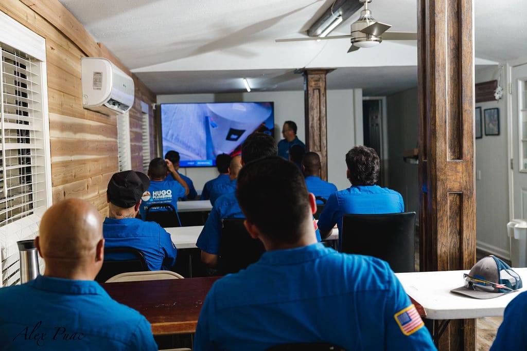 Hugo Plumbing technicians in a training session